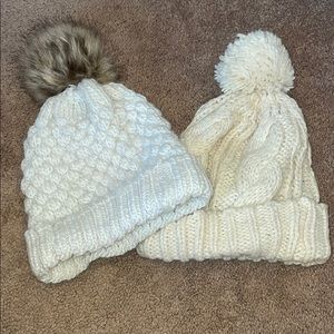 Two women’s white and cream beanies